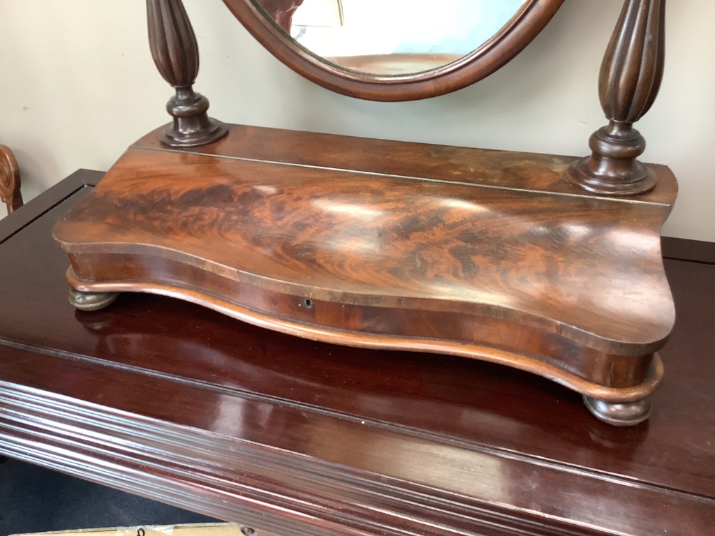 A Victorian mahogany toilet mirror, with hinged box base, width 72cm height 86cm